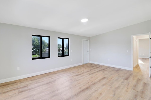 spare room with light wood-type flooring