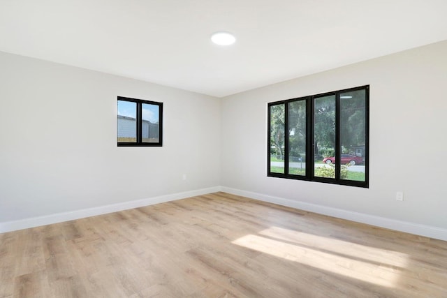 spare room featuring light hardwood / wood-style floors