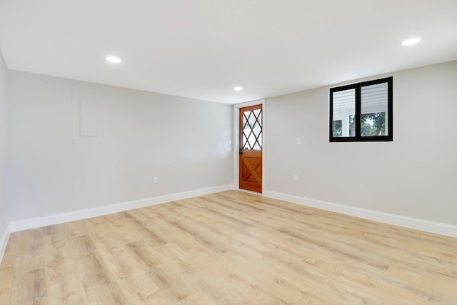 empty room with light hardwood / wood-style floors