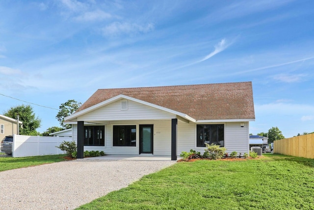 ranch-style house with a front lawn