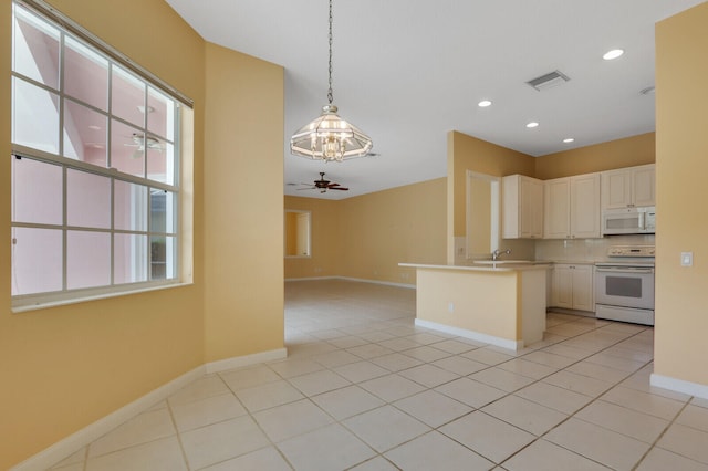 kitchen featuring pendant lighting, white appliances, light tile patterned floors, and ceiling fan