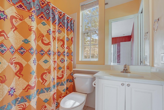 bathroom featuring vanity and toilet