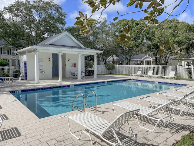 view of swimming pool with a patio