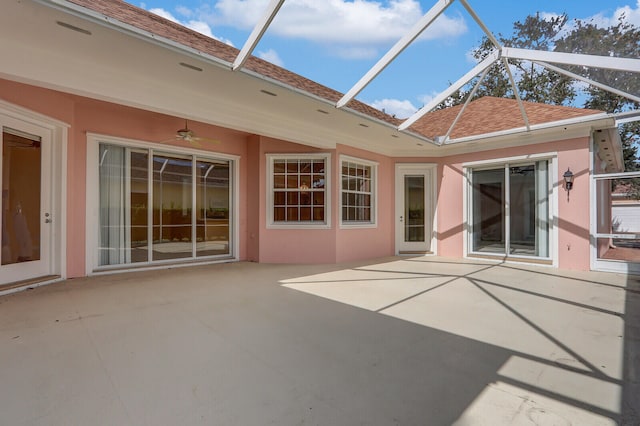 exterior space with ceiling fan