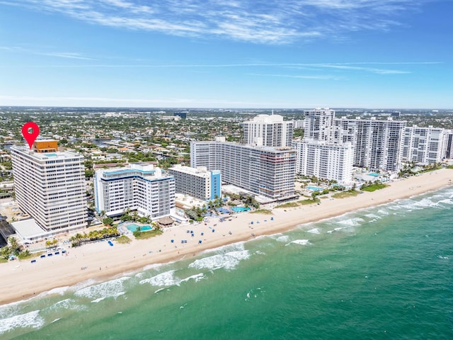 aerial view featuring a view of the beach and a water view