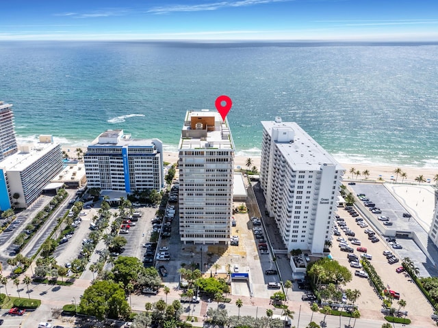 bird's eye view featuring a beach view and a water view