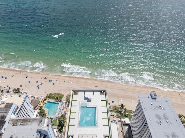 drone / aerial view with a water view and a view of the beach