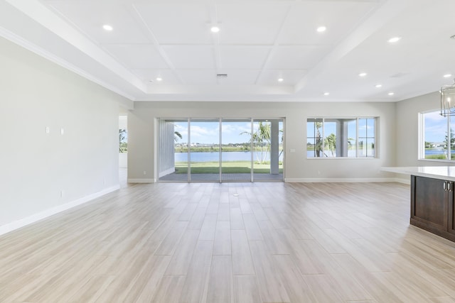 unfurnished living room with a water view