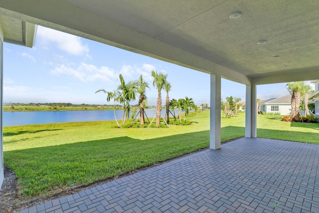 view of patio with a water view