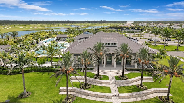 birds eye view of property with a water view