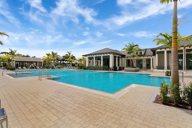 view of pool featuring a patio and pool water feature