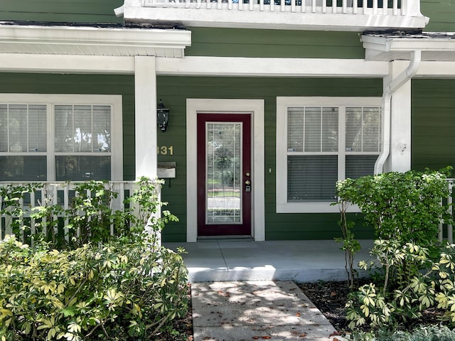 view of front of home with a balcony and a porch