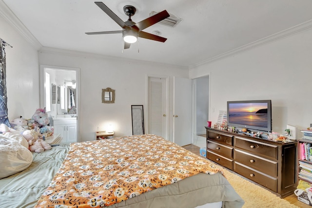 bedroom featuring ornamental molding, connected bathroom, and ceiling fan