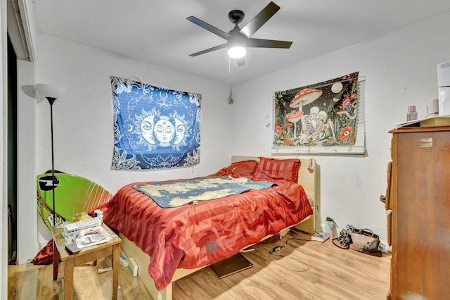 bedroom with ceiling fan and light hardwood / wood-style flooring