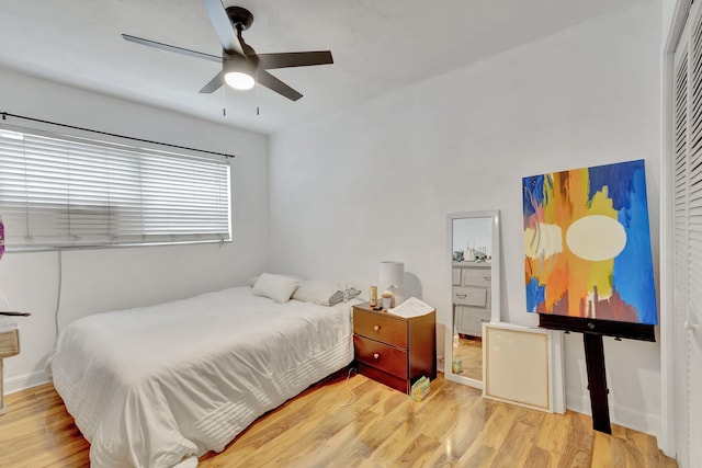 bedroom with ceiling fan and light wood-type flooring