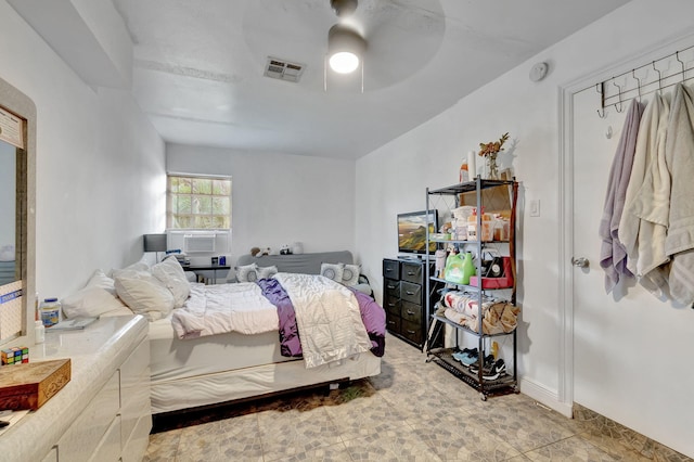 bedroom featuring cooling unit and ceiling fan