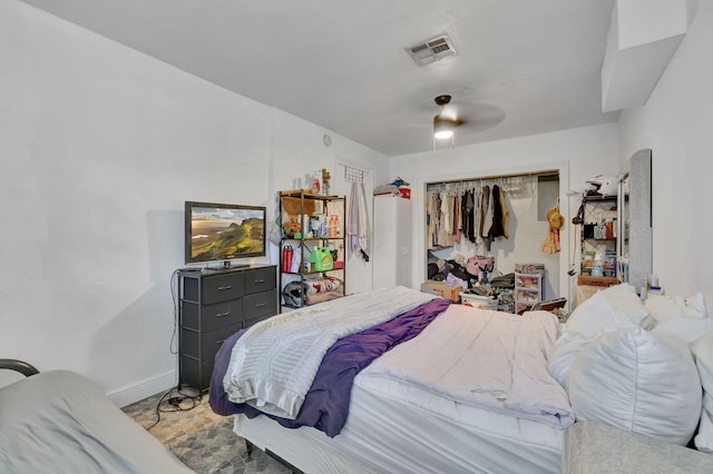 bedroom featuring ceiling fan and a closet