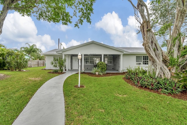 single story home featuring a front lawn