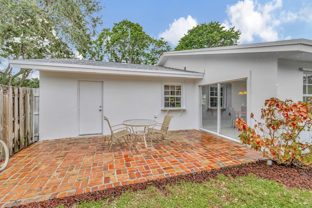 back of property featuring a patio area