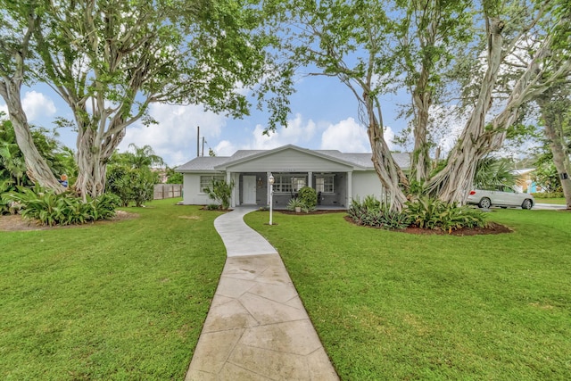 ranch-style home with a front lawn