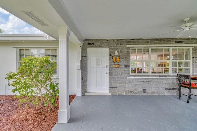 property entrance featuring ceiling fan