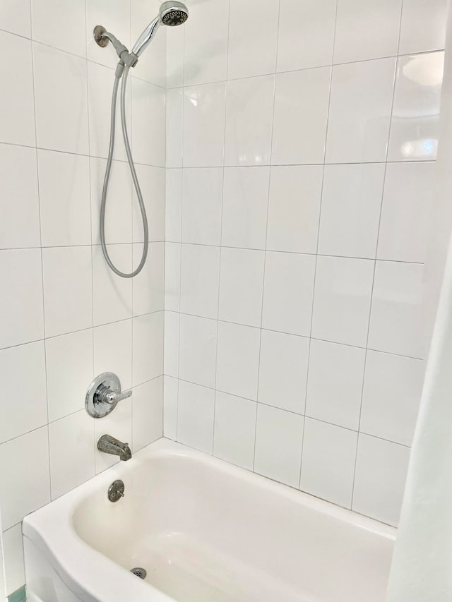 bathroom featuring shower / tub combo with curtain