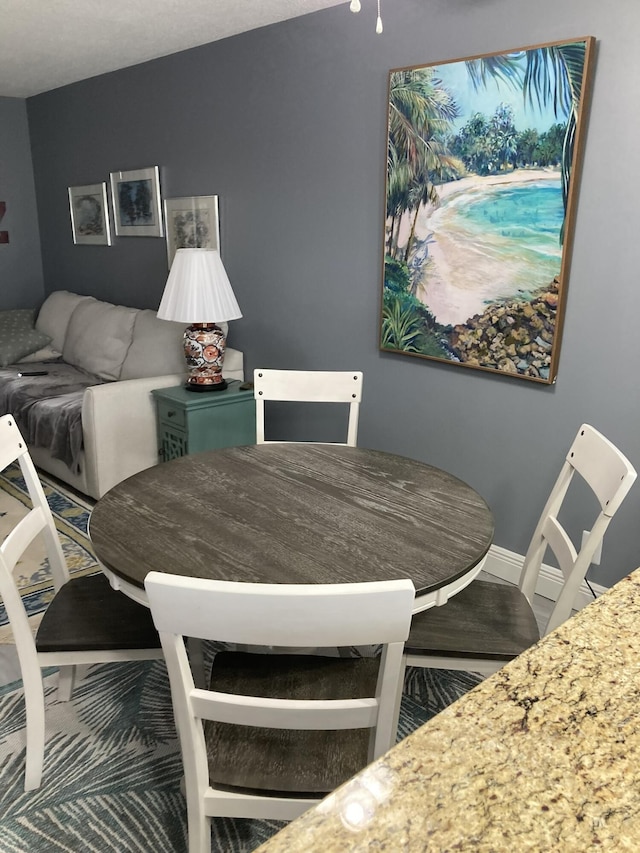 108 NE 20th Ave Unit 205, Boynton Beach, FL 33435 - dining space featuring baseboards