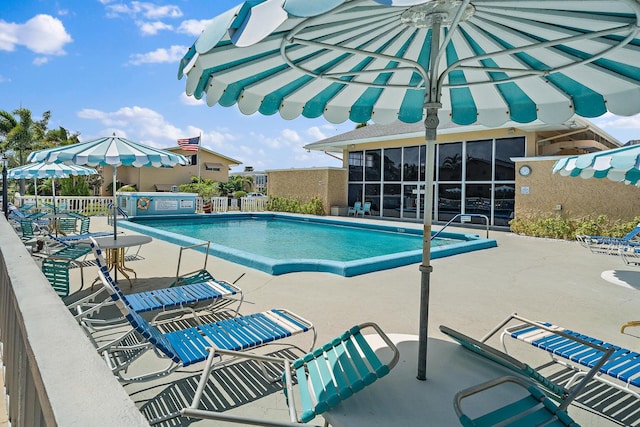 view of swimming pool with a patio area