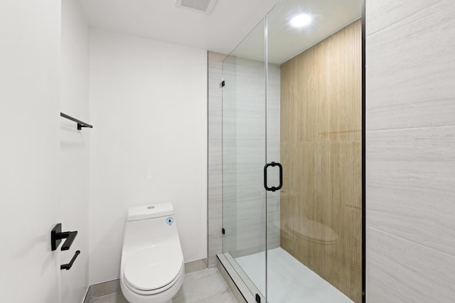 bathroom featuring tile patterned floors, visible vents, a stall shower, and toilet