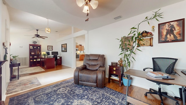 home office featuring ceiling fan and hardwood / wood-style flooring