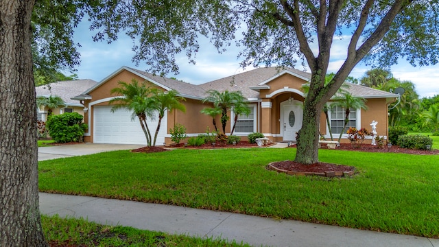 ranch-style home featuring a garage and a front lawn