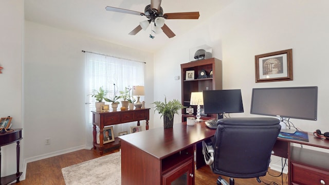 office with ceiling fan, dark hardwood / wood-style flooring, and vaulted ceiling