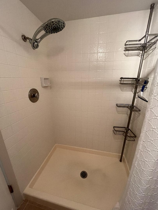 bathroom with tiled shower