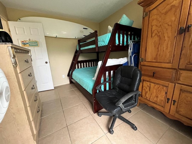 bedroom featuring light tile patterned floors