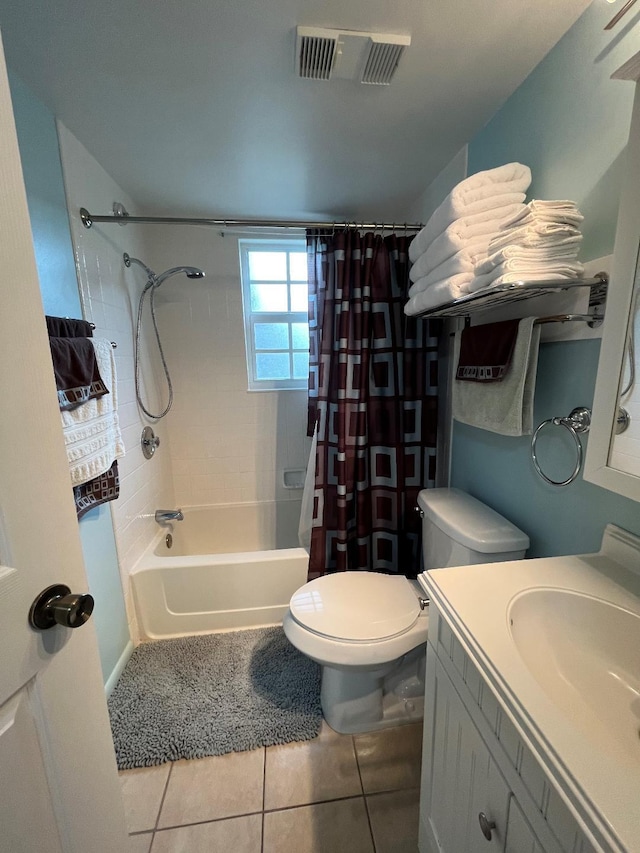 full bathroom featuring shower / bath combo, visible vents, toilet, vanity, and tile patterned flooring