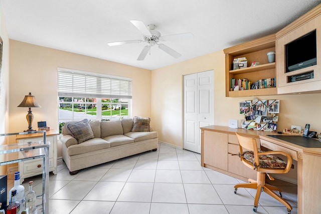 office space with light tile patterned floors and ceiling fan