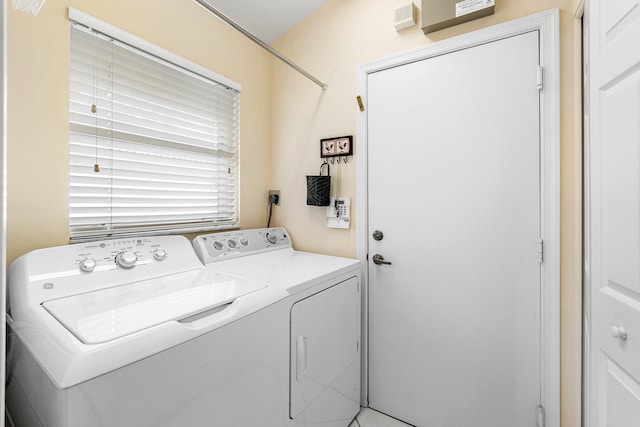 washroom featuring washing machine and dryer