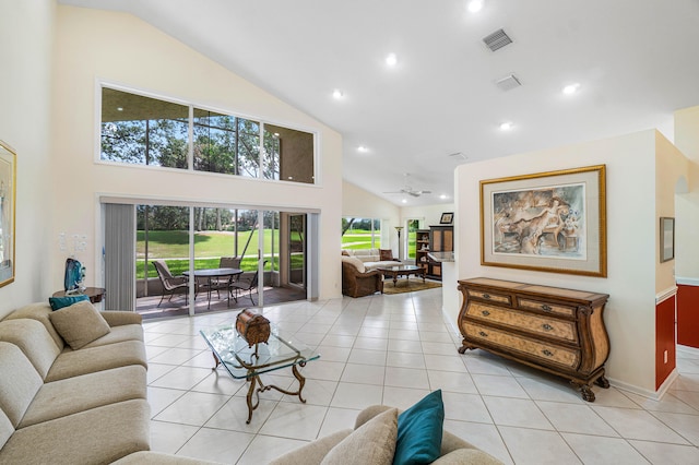 tiled living room featuring ceiling fan and high vaulted ceiling