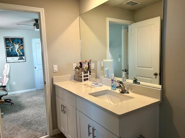 bathroom featuring vanity and ceiling fan