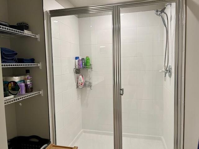 bathroom with a shower with shower door