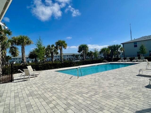 view of swimming pool featuring a patio area