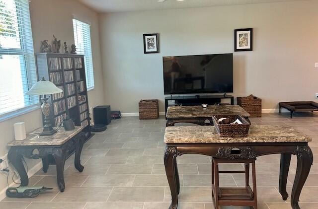 living room with light tile patterned flooring