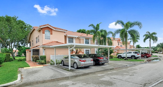 view of front of home with a carport