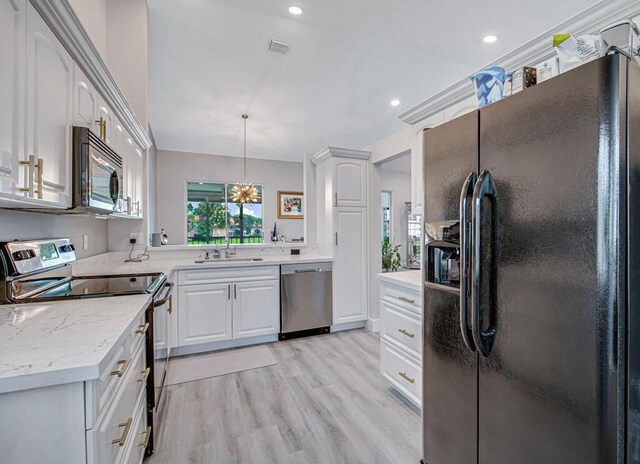 kitchen with a healthy amount of sunlight, black / electric stove, white cabinetry, and stainless steel dishwasher