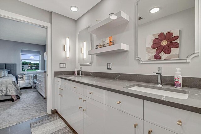 bathroom featuring vanity, toilet, tile patterned flooring, and a shower with door