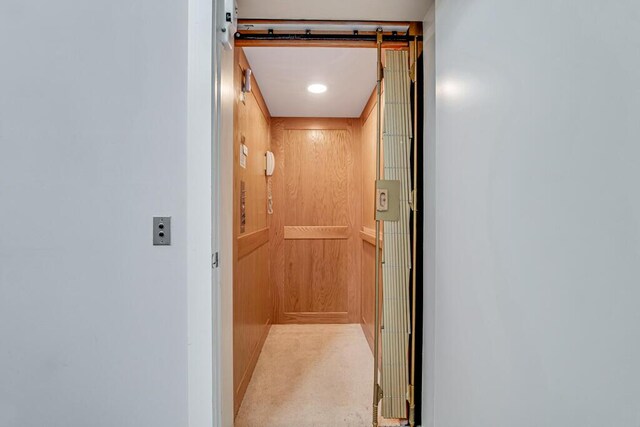 laundry area featuring electric panel, cabinets, and washer and dryer