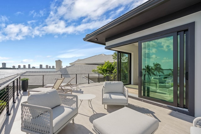 view of patio featuring a balcony