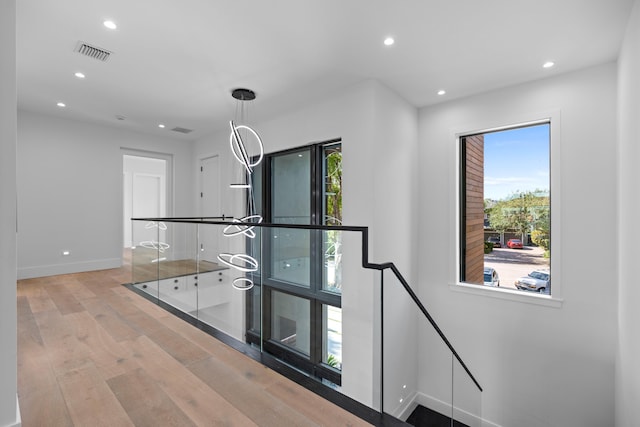 interior space with a wealth of natural light and light hardwood / wood-style floors