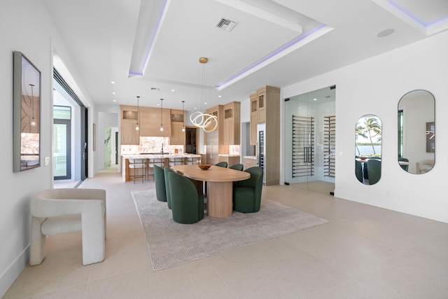 interior space featuring a wealth of natural light and a raised ceiling