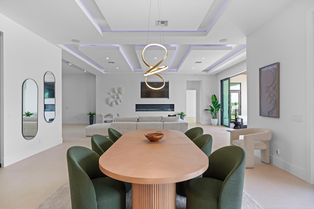 dining space with a tray ceiling